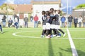 Young football players. Children play a soccer game. Little children cheer for the goal