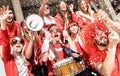 Young football supporter soccer fans cheering with flag and confetti Royalty Free Stock Photo