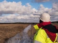 Young Foreman At Construction Site is inspecting ongoing production in difficult cold conditions.