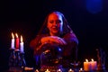 a young fortuneteller in the salon is engaged in magic