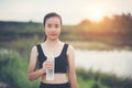 Young  woman hand holding water bottle after running exercise Royalty Free Stock Photo