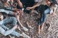 Young and free. Close up top view of modern young people pouring