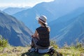 Young free woman travel alone in Andes mountains in Peru. Landscape with solo female tourist, mountains and copy space Royalty Free Stock Photo