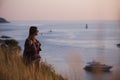 Young freedom woman enjoy ocean sunset on mountain peak Royalty Free Stock Photo