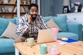 Young freelance business man or exchange student working remotely from his home office on laptop computer. African American work Royalty Free Stock Photo