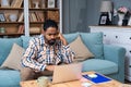 Young freelance business man or exchange student working remotely from his home office on laptop computer. African American work Royalty Free Stock Photo