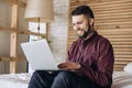 Young freelancer man working at computer at home Royalty Free Stock Photo