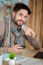 young freelancer smiling and looking phone at office Royalty Free Stock Photo