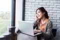 Young Freelancer Woman Working on Computer Laptop in Cozy House, Female in Thoughtful Posture Looking Outside Window Royalty Free Stock Photo