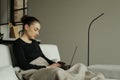 Young woman working from home on her laptop computer Royalty Free Stock Photo