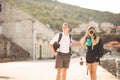 Young freelancing photographers enjoying traveling and backpacking.Photojournalism.Documentary travel photos.Lightweight travel Royalty Free Stock Photo