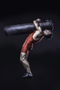 Young freestyle wrestler in red wrestling uniform training