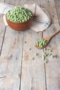 Young fresh green peas on wooden table viewed from above. Green pea pod table peas. Closeup of fresh green peas Pisum sativum Royalty Free Stock Photo