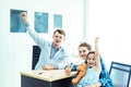 Young friendly caucasian pediatrician doctor is examining child patient girl with her mother ,consultation with a stethoscope and Royalty Free Stock Photo