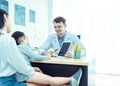 Young friendly caucasian pediatrician doctor is examining child patient girl with her mother ,consultation with a stethoscope and Royalty Free Stock Photo