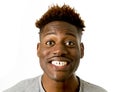 Young friendly and happy afro american man smiling excited and posing cool and cheerful isolated