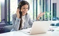 Young friendly operator woman customer service agent with phone VOIP headsets working in a call center Royalty Free Stock Photo