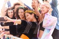 Young Friends In Audience Behind Barrier At Outdoor Music Festival Posing For Selfie Royalty Free Stock Photo