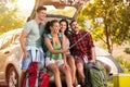 Young friends in countryside on camping trip taking selfie Royalty Free Stock Photo