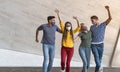 Young friends dancing together while wearing face mask outdoor - Happy people having fun in city after corona virus quarantine Royalty Free Stock Photo