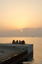 Young friends enjoying amazing sunset