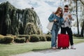 Young friends exploring city sights with map on sunny vacation day Royalty Free Stock Photo