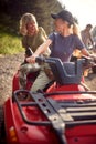 Young friends female driving a off road buggy car Royalty Free Stock Photo