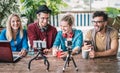 Young friends group sharing info on streaming platform with webcam - Startup marketing concept with millennial guys and girls Royalty Free Stock Photo