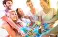 Young friends having fun at beach party on holi colors festival - Happy people playing together with genuine carefree mood Royalty Free Stock Photo