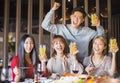 Friends having fun in hot pot restaurant Royalty Free Stock Photo