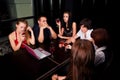 Young people with laptop in a night bar Royalty Free Stock Photo