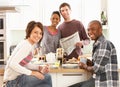 Young Friends Preparing Breakfast In Kitchen Royalty Free Stock Photo