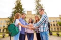 Young friends putting their hands on top of each other. They achievement harmony in team Royalty Free Stock Photo