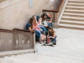 Young friends relax on Grand Staircase at Art Institute of chicago