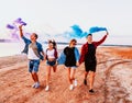 Young friends running with hand flare or fusee Royalty Free Stock Photo