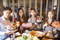 Friends showing seafood  beef and pork slices  in hot pot restaurant Royalty Free Stock Photo