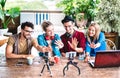 Young friends startupper group having fun on streaming platform with webcam - Start up marketing concept Royalty Free Stock Photo