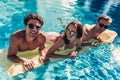 Young friends in swimming pool Royalty Free Stock Photo