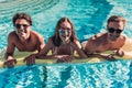 Young friends in swimming pool Royalty Free Stock Photo