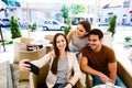 Young friends taking selfie while sitting at cafe Royalty Free Stock Photo