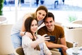 Young friends taking selfie while sitting at cafe Royalty Free Stock Photo