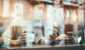 Young friends using smartphones inside vintag bar drinking coffee - Workers doing breakfast before work - Window view - Technology Royalty Free Stock Photo