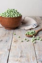 Young frozen green peas on wooden table viewed from above. Green pea pod table peas. Closeup of fresh green peas Pisum sativum Royalty Free Stock Photo