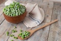 Young frozen green peas on wooden table viewed from above. Green pea pod table peas. Closeup of fresh green peas Pisum sativum Royalty Free Stock Photo