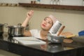 Young frustrated Asian woman in domestic chores stress - lifestyle home portrait of beautiful overwhelmed and stressed Korean girl Royalty Free Stock Photo