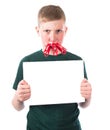 Young and frustrated boy with clothespins on his lips holds in hands an empty plate Royalty Free Stock Photo