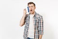 Young fun crazy dizzy loony wild housekeeper man in checkered shirt holding brush for cleaning isolated on white