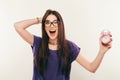 Young fun woman in glasses with alarmclock. Emotion smile Royalty Free Stock Photo