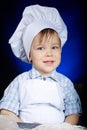 Young funny cook with kitchenware