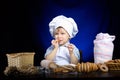 Young funny cook with kitchenware